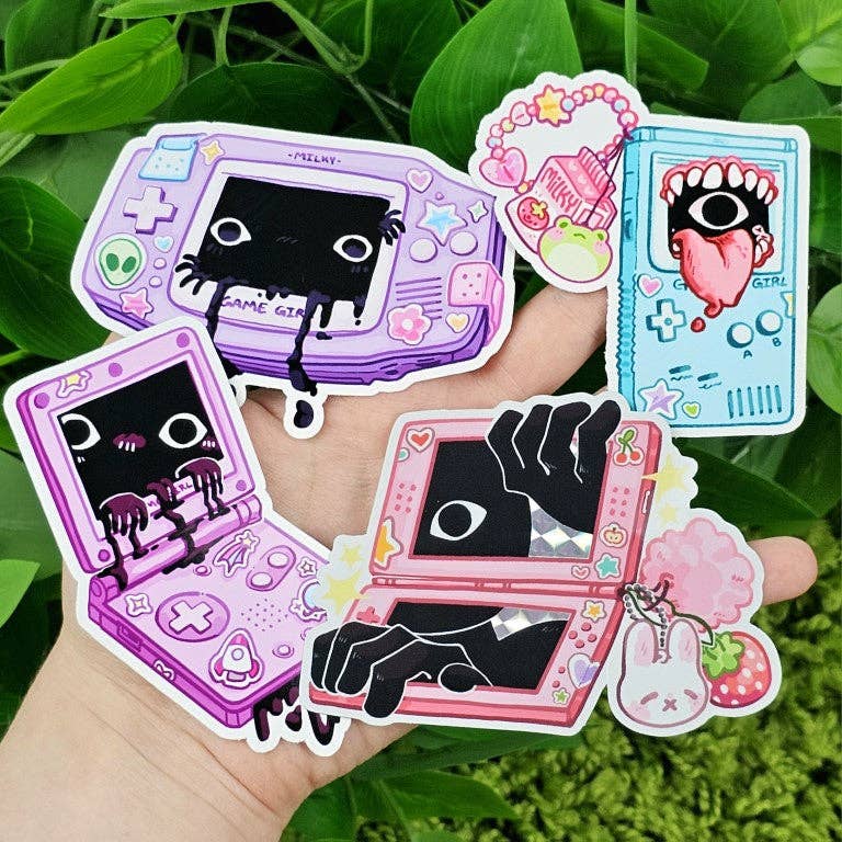 Creepy Game Console Stickers with black creatures emerging from game screens held in a hand.