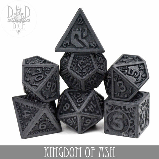 Kingdom of Ash 7-piece dark gray acrylic DND dice set with intricate carvings.