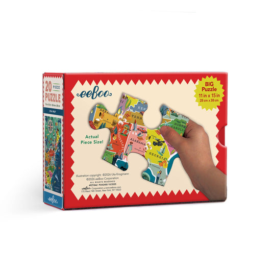 USA Map 20 Piece Puzzle showing states and landmarks held in a hand.
