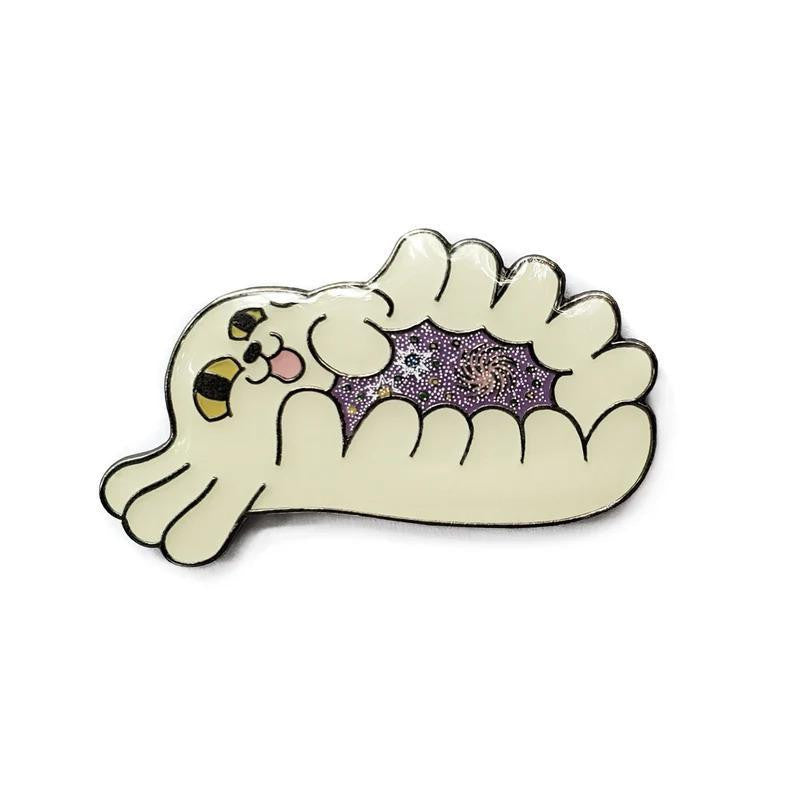 Kolorspun Charlotte Midnight Gospel enamel pin of a white cat curled in a dumpling with sparkly purple center.