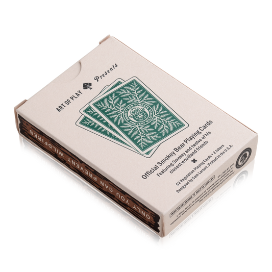 Smokey Bear playing cards in a box.