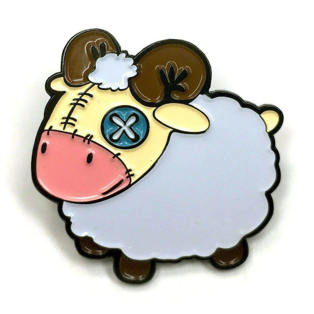 Kolorspun Pins Plush Sheep Enamel Pin with pink nose, brown horns, blue X eye, and white fluffy body.