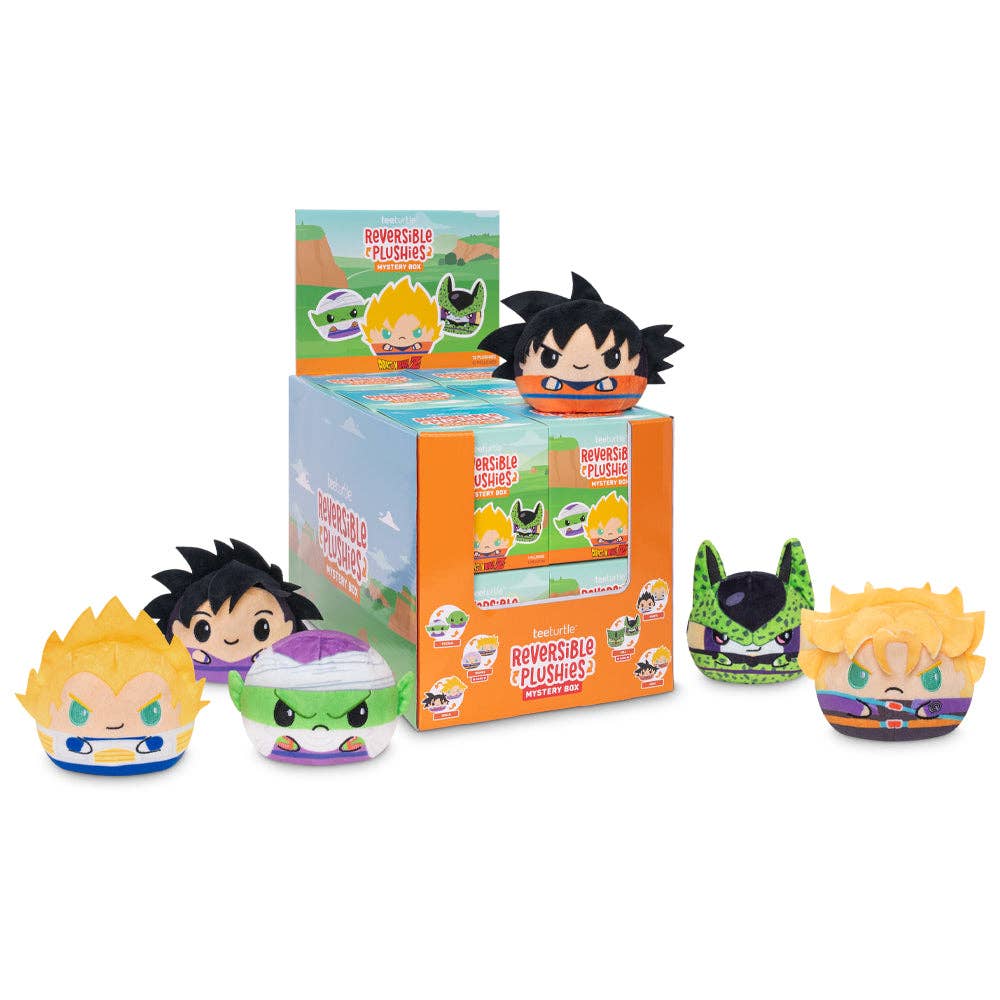 Six Dragon Ball Z reversible plushies displayed with an open mystery box.