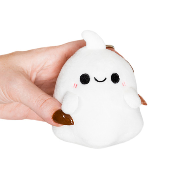 Micro Ghost Keychain: small white plush ghost with a smiling face and rosy cheeks held in a hand.