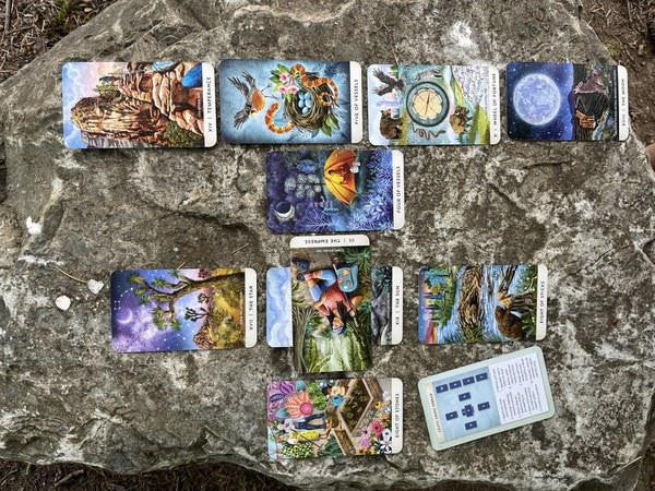 The Tarot for the Great Outdoors deck displayed on a rock.