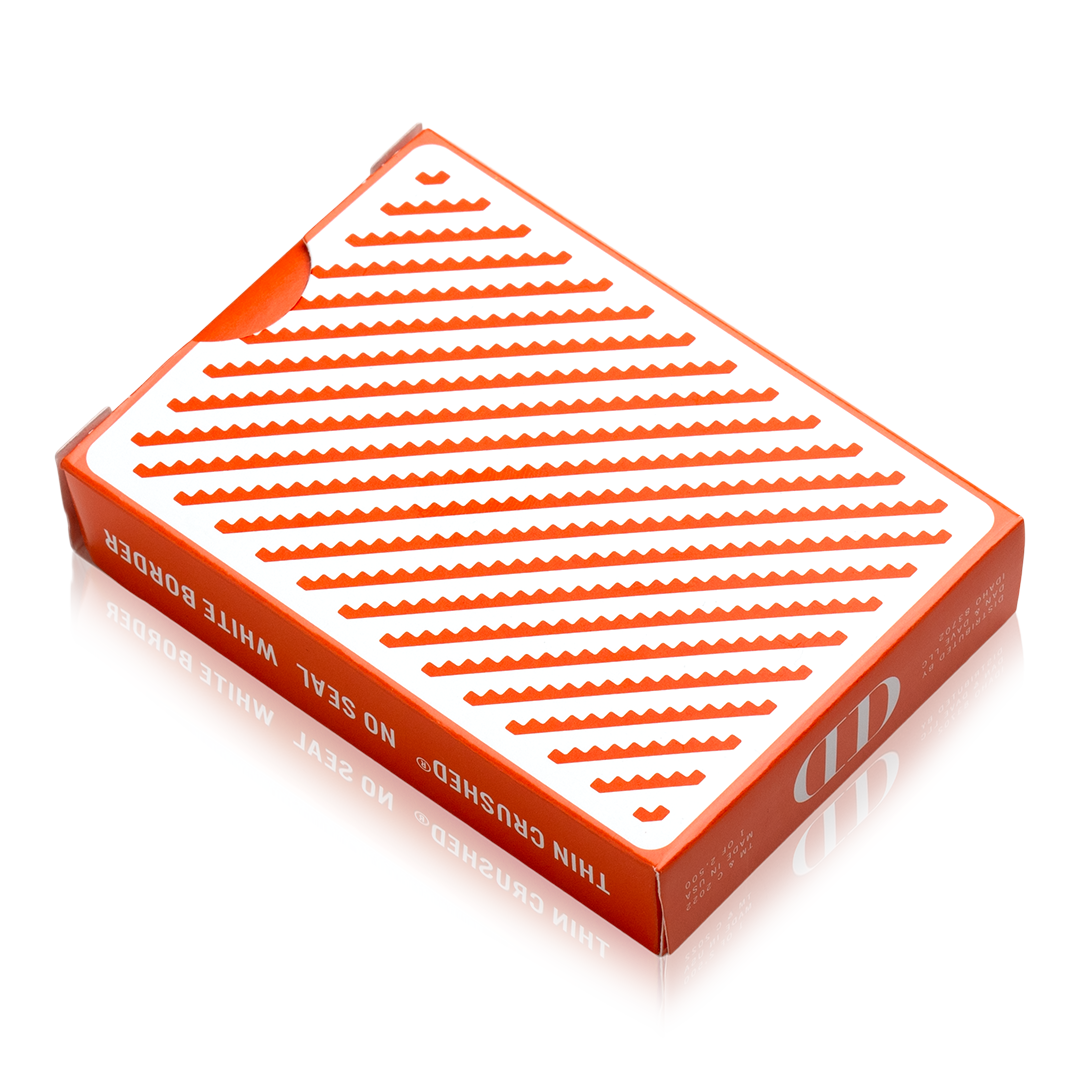 Damn Good Cards, No. 5 poker-size tuck box, orange and white diagonal zig-zag pattern, thin crushed stock.