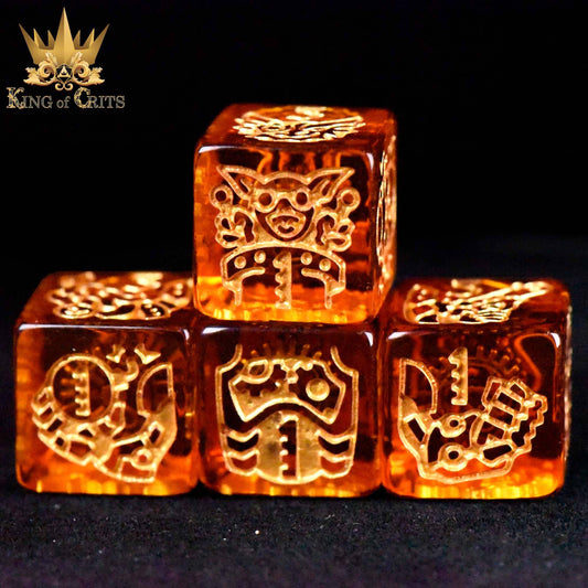 Four orange translucent Ancient Artificer 11 dice set with gold designs; King of Crits logo in corner.