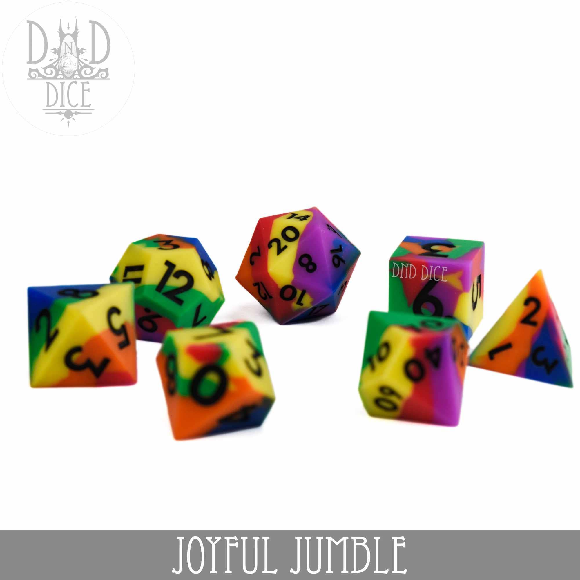 Joyful Jumble (Silicone) polyhedral dice set of seven with rainbow patterns on a white background.