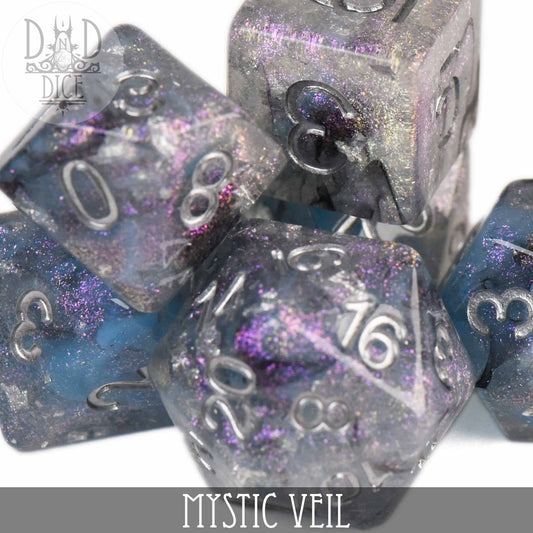Mystic Veil 7-dice set in glittery blue, purple, and silver resin with white numbers.