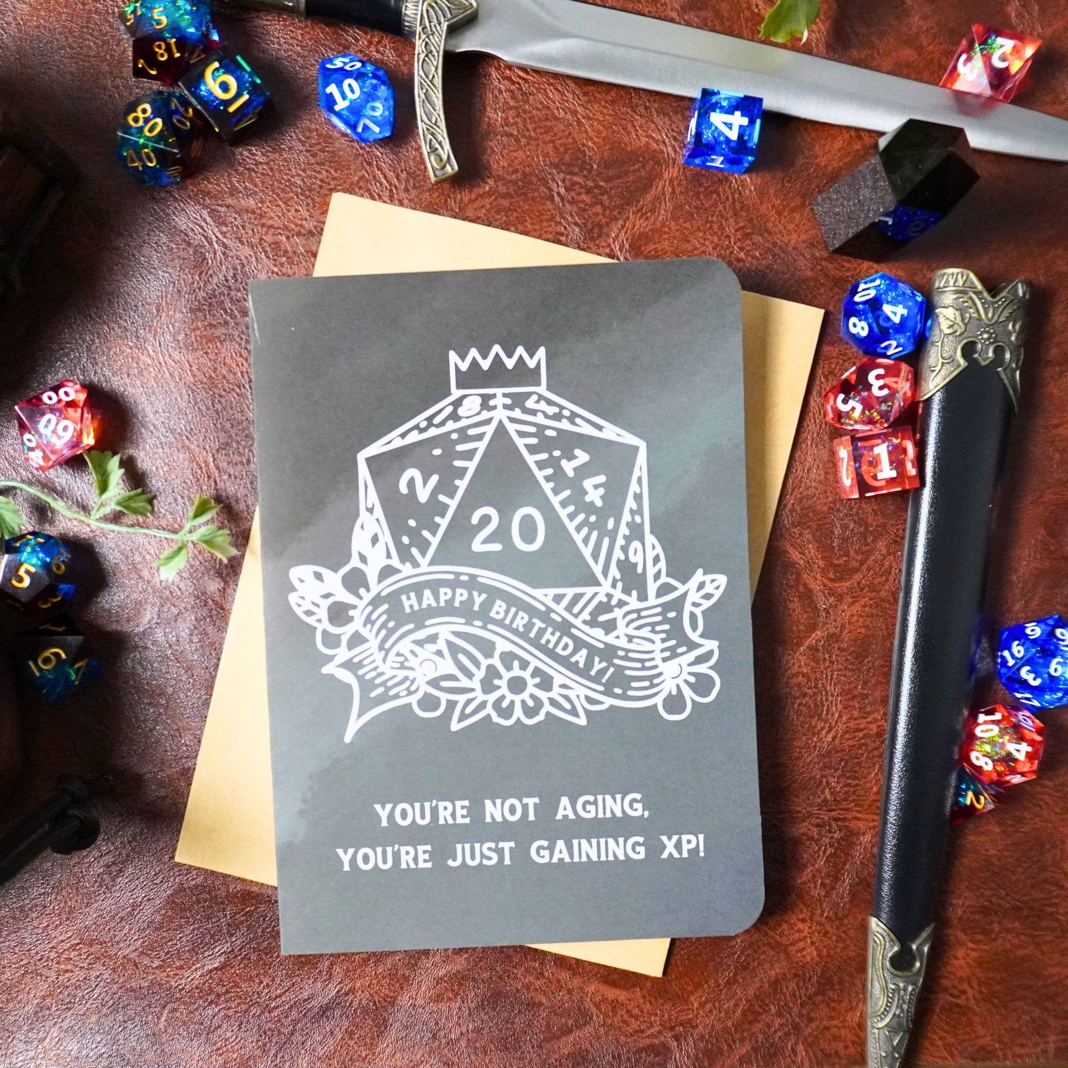Youre Not Aging XP DnD Birthday Card with dice and swords design, handmade greeting card for birthdays.