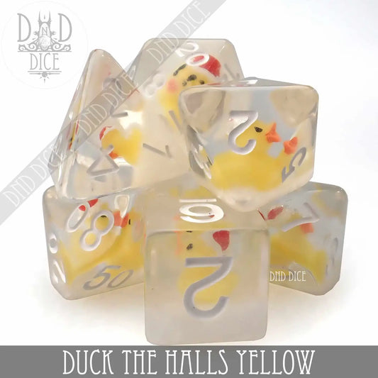 Duck the Halls Dice Set Yellow, 7 clear resin polyhedral dice with small yellow ducks inside.