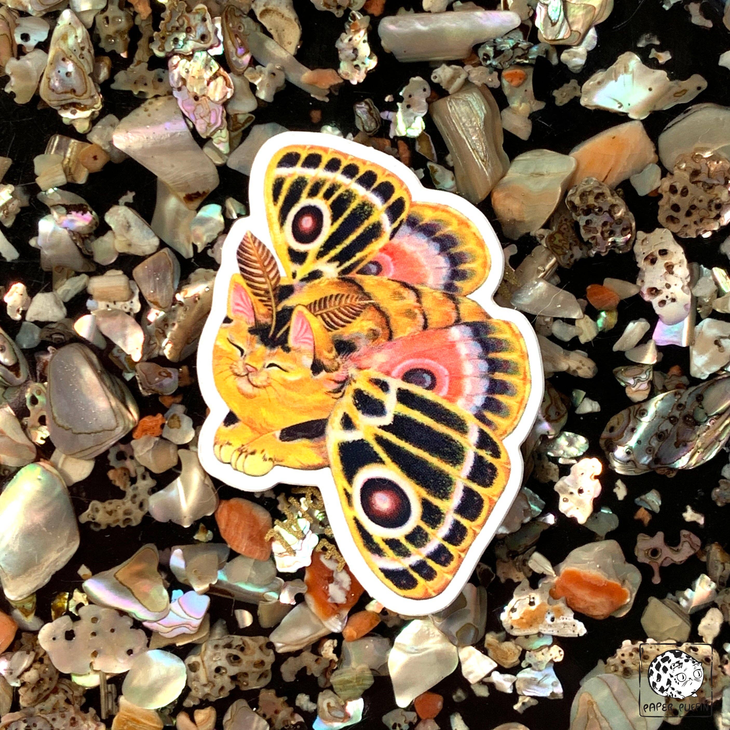 Moth Cat Vivid Joy die-cut sticker: a cat with yellow, orange, and black patterned moth wings.