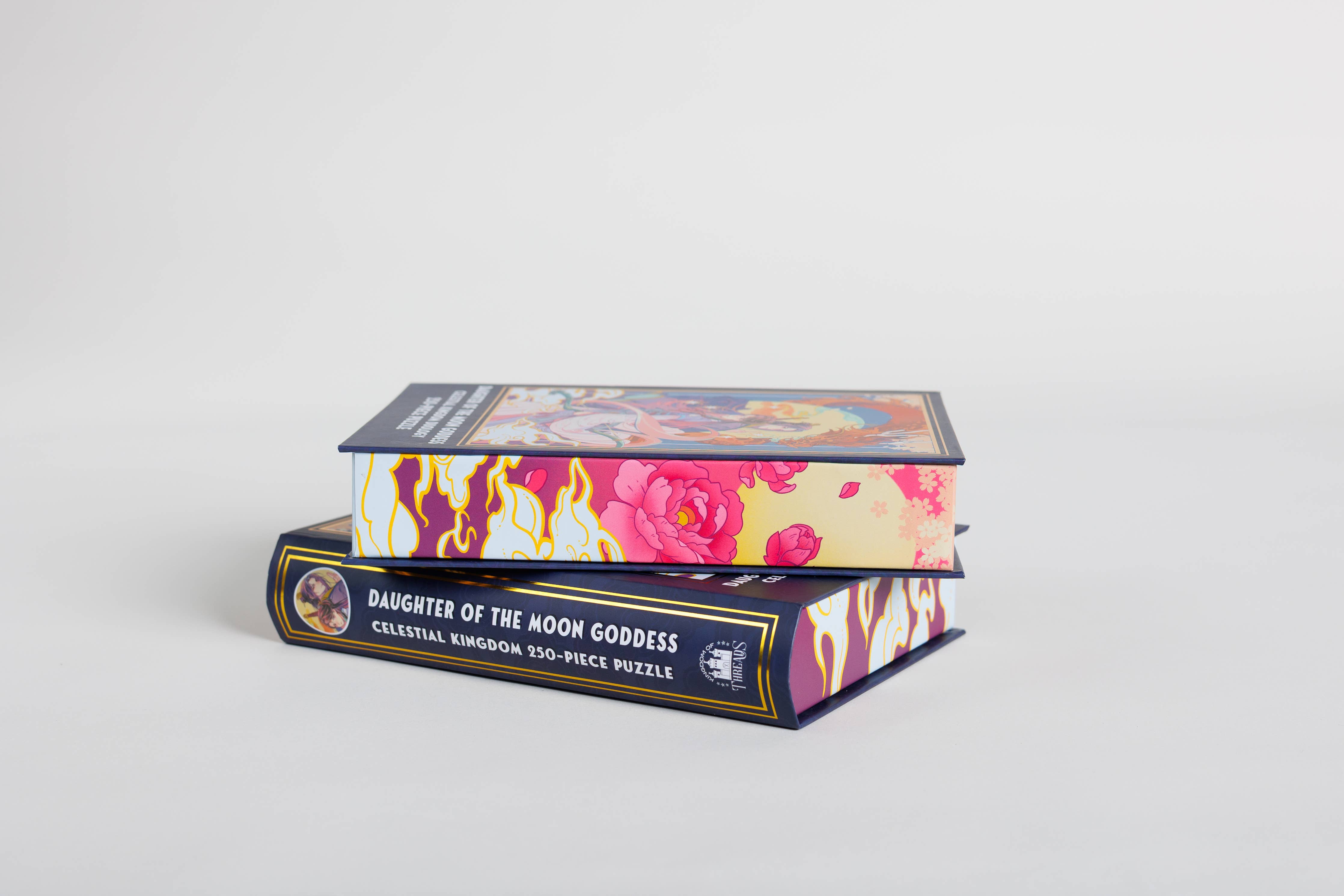 Daughter of the Moon Goddess Keepsake Puzzle box stacked with another puzzle box.