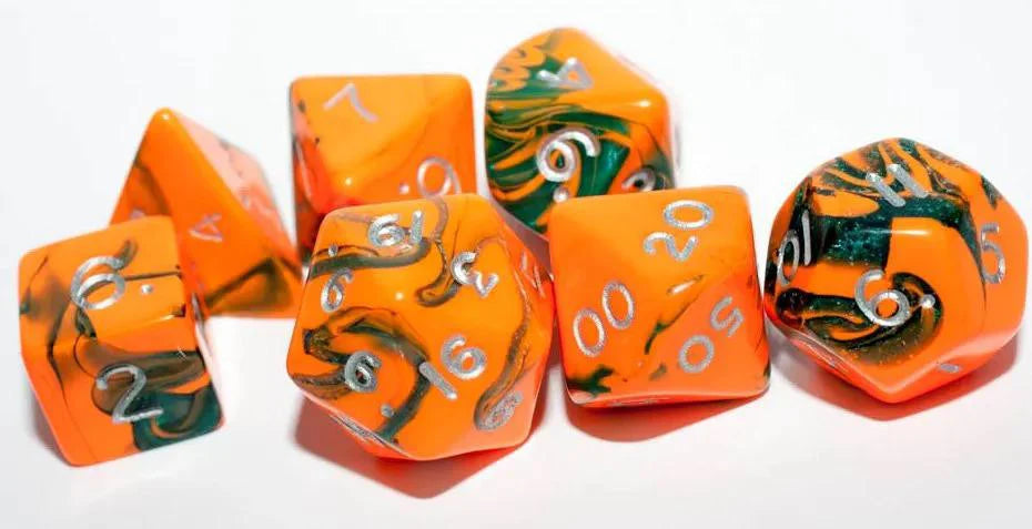 Orange and green resin polyhedral dice set with silver numbers for tabletop RPGs like Dungeons & Dragons.