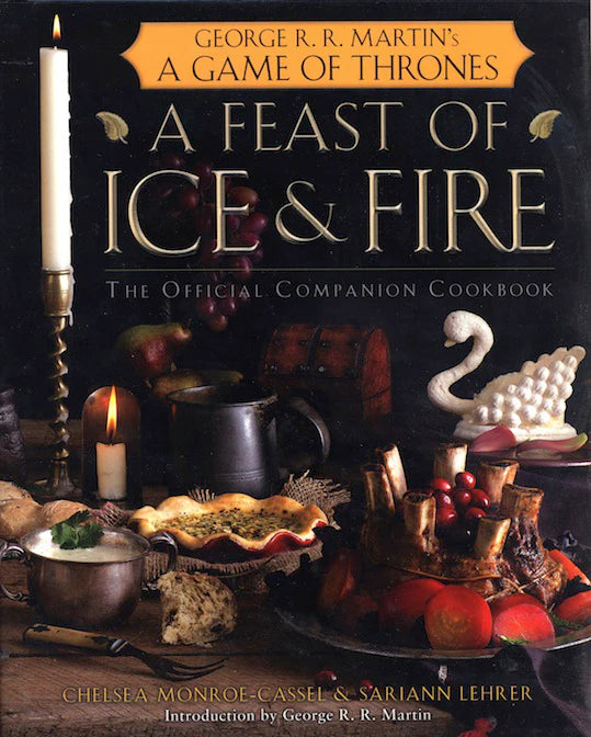 A Feast of Ice and Fire: a Game of Thrones cookbook cover with medieval recipes and a white swan centerpiece.