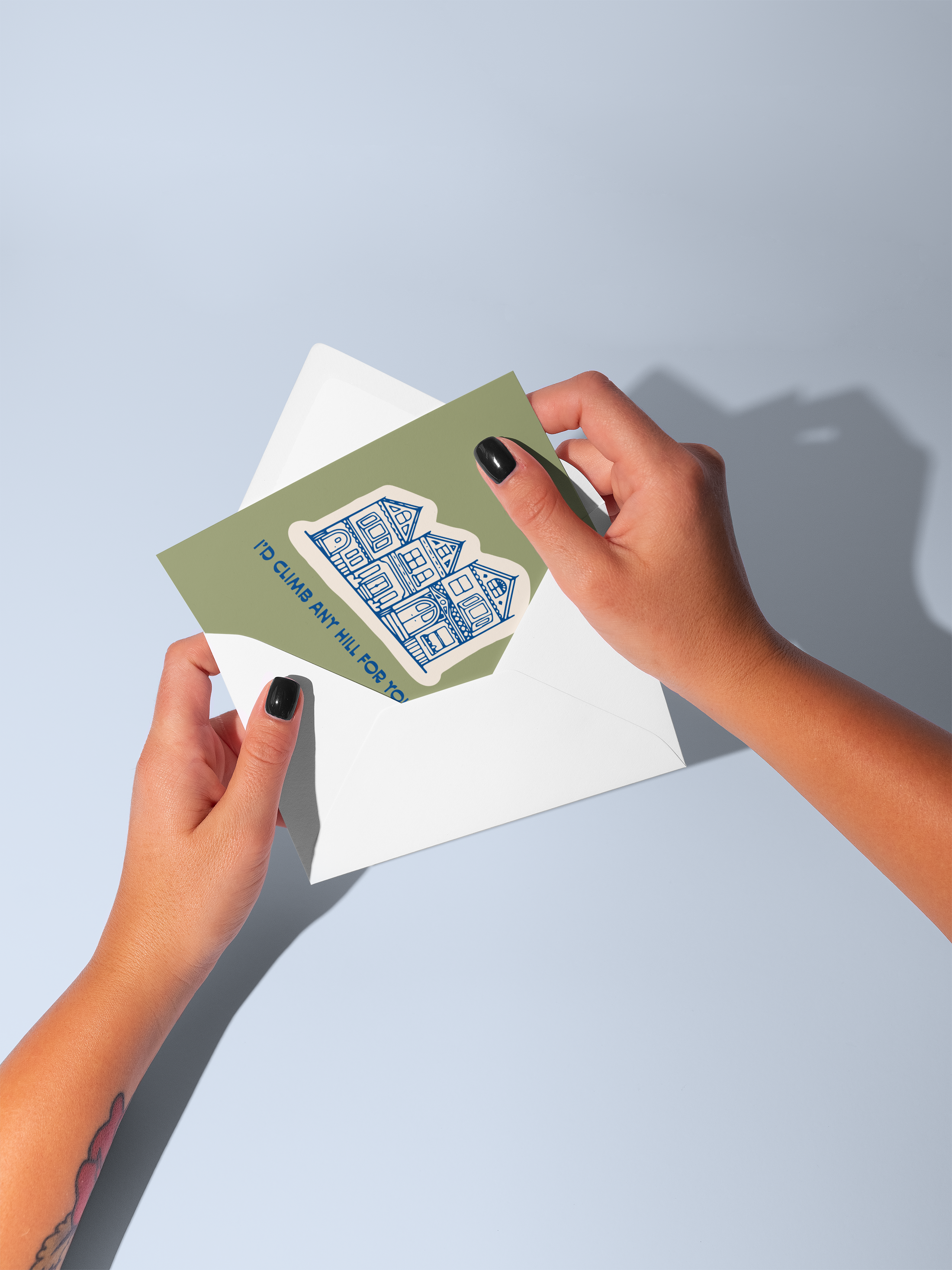 Id Climb Any Hill For You greeting card held above an open white envelope.