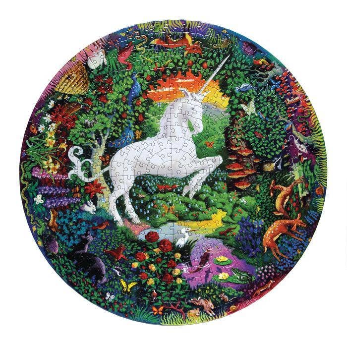 Unicorn Garden 500 Piece Round Puzzle with a white unicorn in a colorful forest with animals and plants.