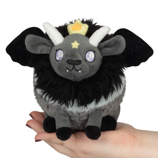 Black and gray plush Baphomet Snugglemi Snackers with horns, crown, and star eyes.