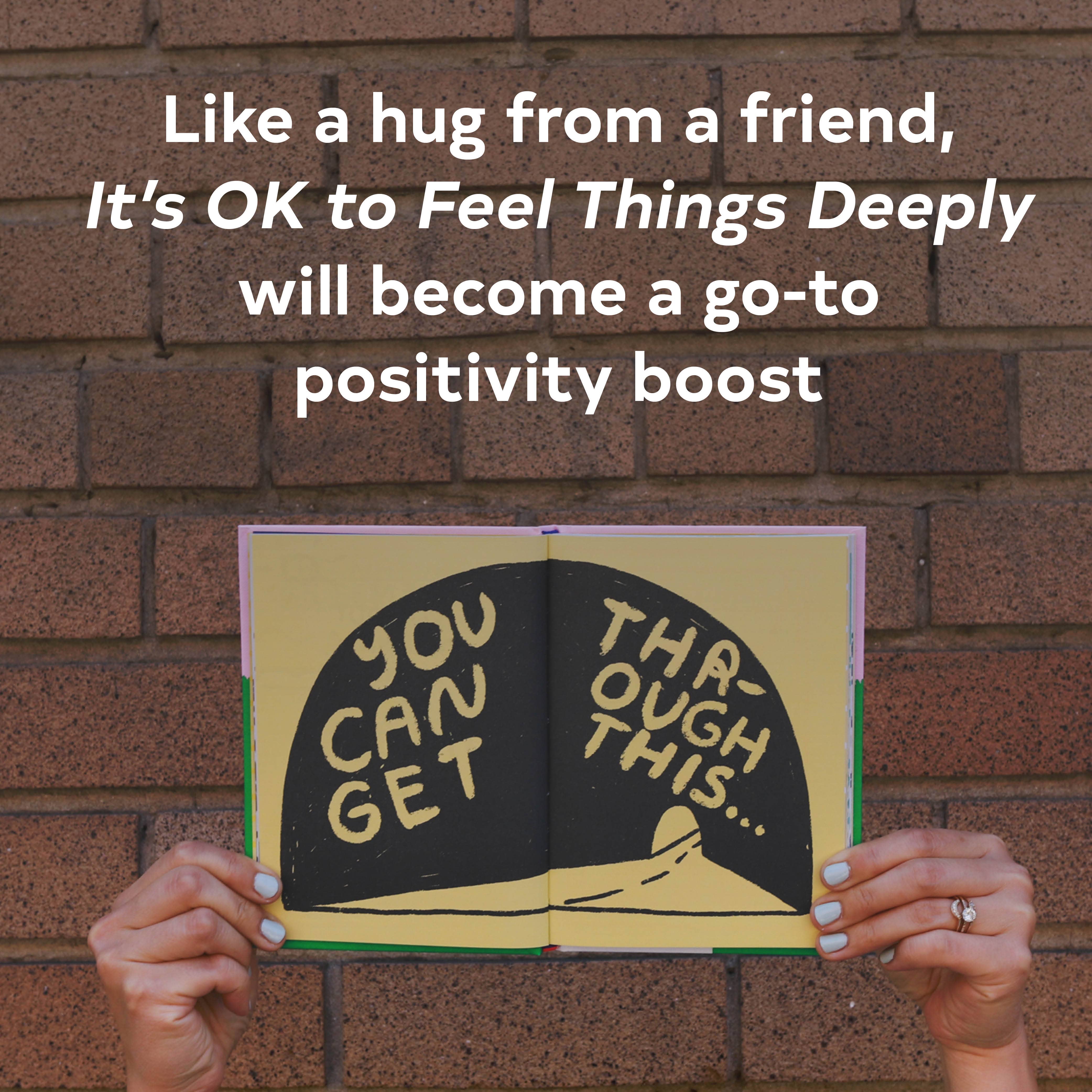Person holding open Its OK to Feel Things Deeply book with uplifting text visible above.