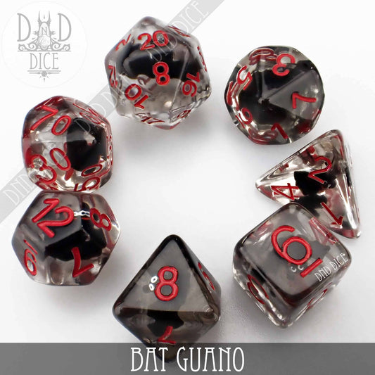 Bat Guano 7-piece resin DND dice set, smoky black with red numbers on a white surface.