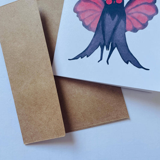 Mothman Cryptic Humor Card featuring a red and black moth, includes two brown kraft envelopes.