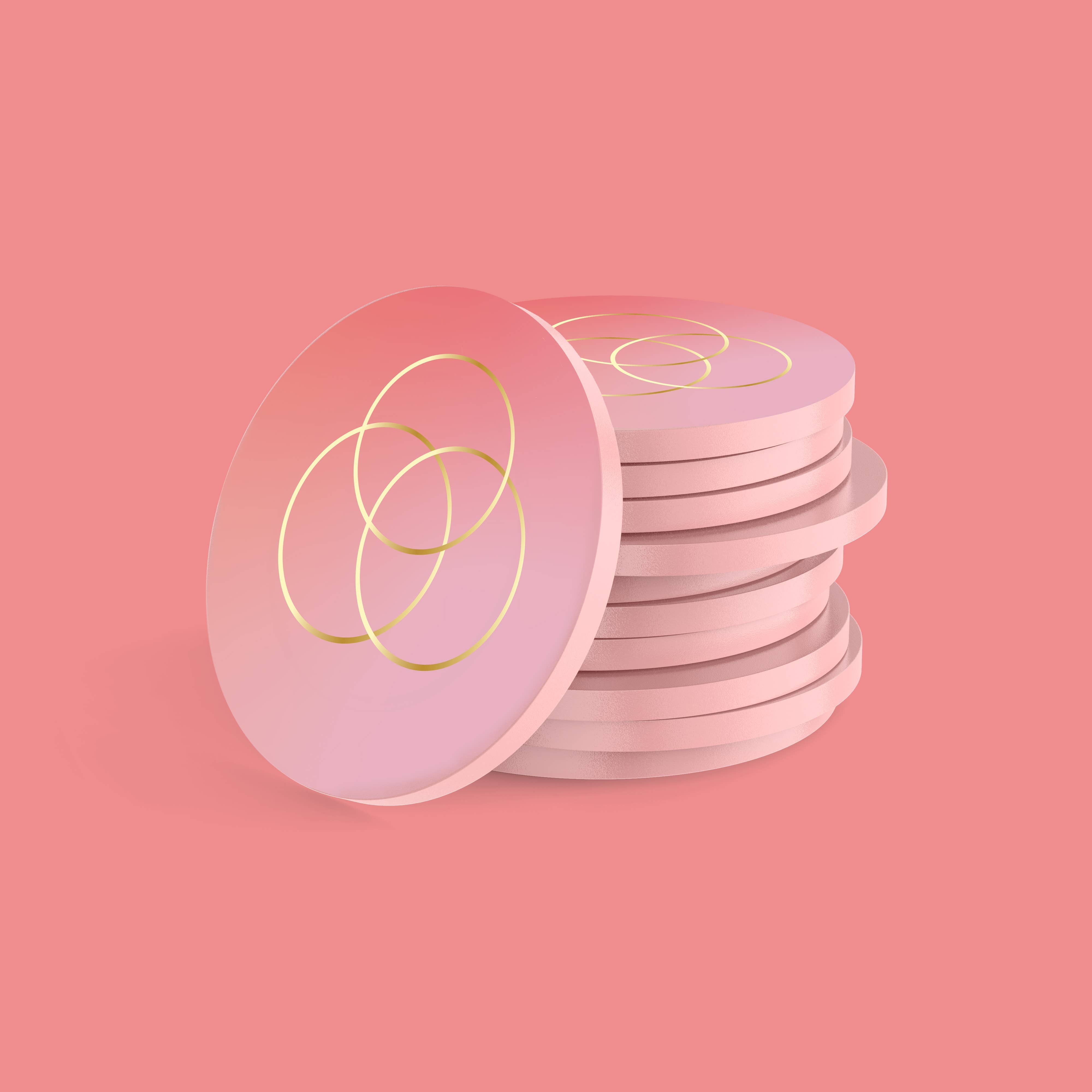 Sync party game with pink round coasters featuring gold interlocking circles.