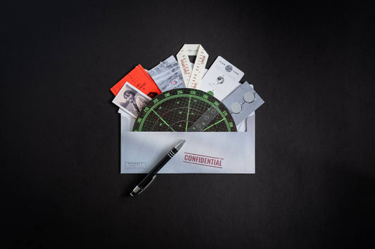 Family Secrets Series: Episode 2 - Missing Person kit with a CONFIDENTIAL envelope, protocol items, and a pen.