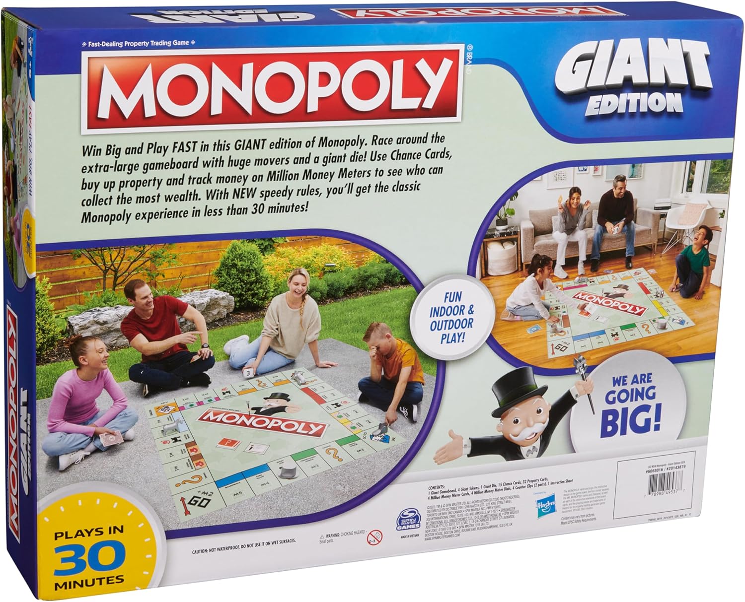 Back of Giant Monopoly box displaying people playing the board game on the floor with colorful text and images.