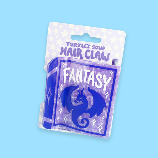 Purple Fantasy Book hair claw featuring a dragon design.