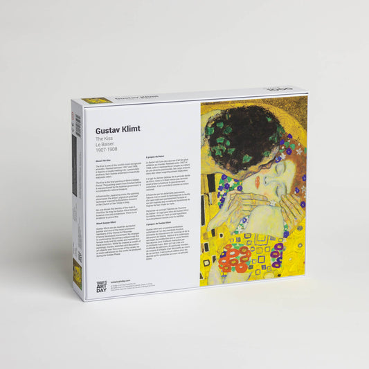 Back of Gustav Klimt Kiss puzzle box displaying artwork and painting details.