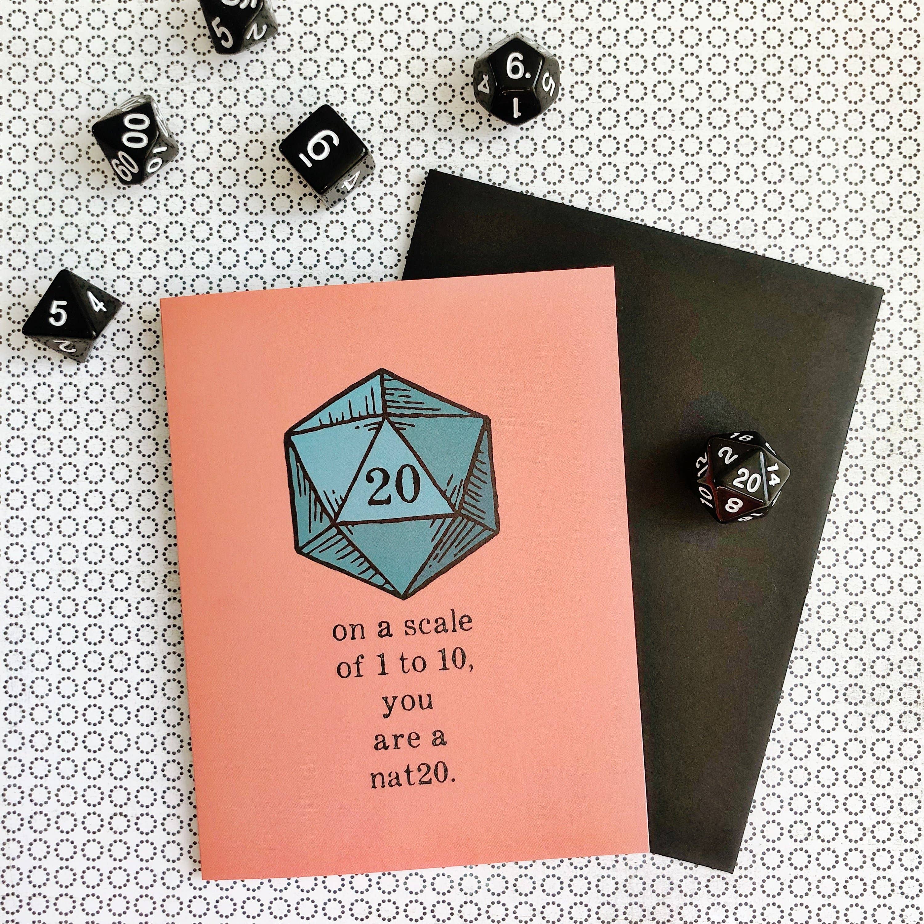 You are a nat20 pink RPG greeting card featuring a blue 20-sided die and scattered dice.