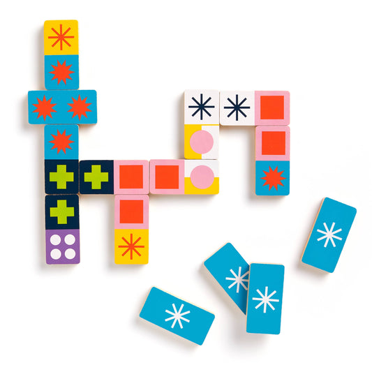 Jonathan Adler Helsinki Wood Domino Set with star, plus sign, and dot patterns.