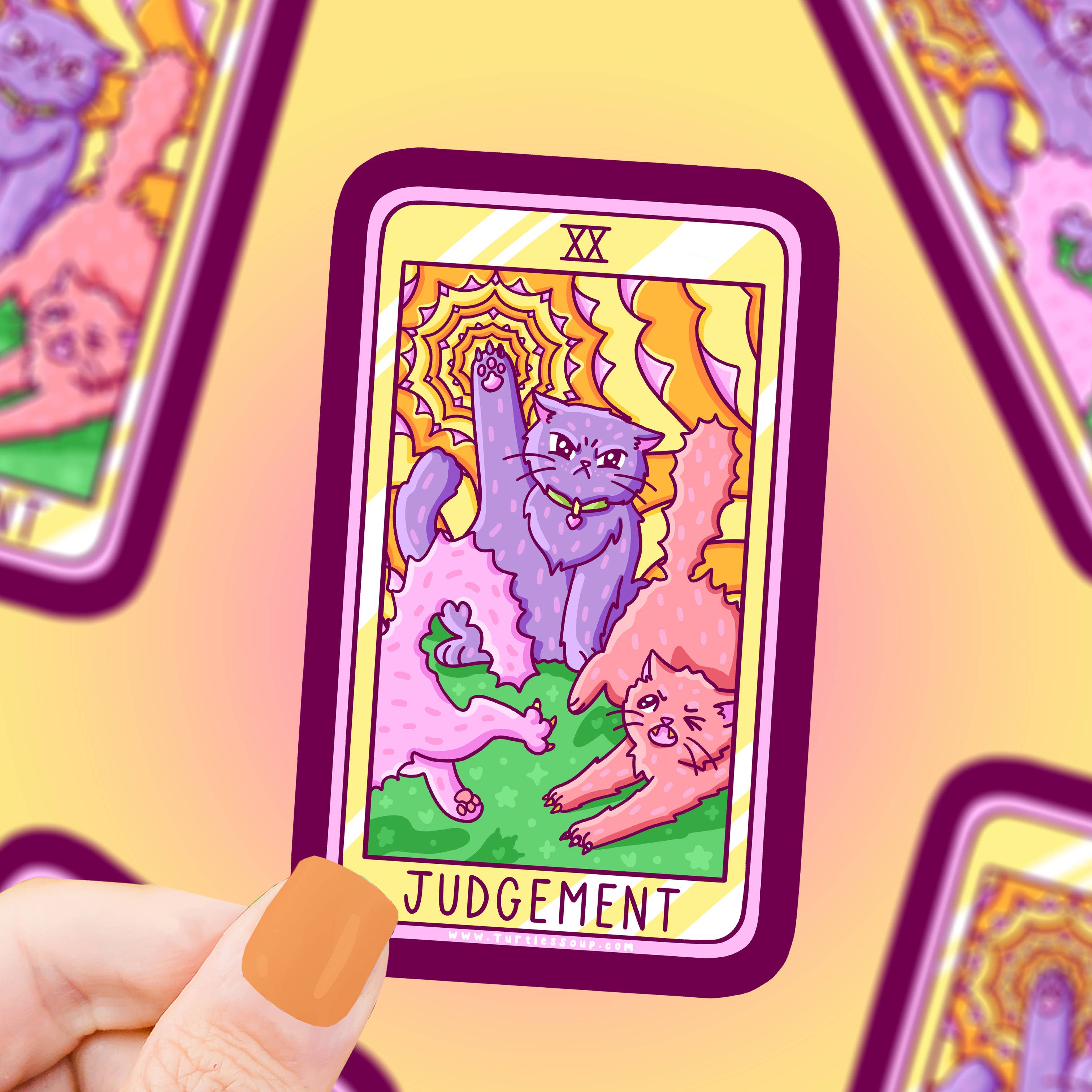 Hand holding Judgement Cat Major Arcana Tarot Card Vinyl Sticker; blurred tarot stickers in background.