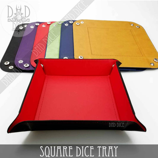 Square Dice Tray in red artificial leather (8.5x8.5) with five colorful flat trays in the background.