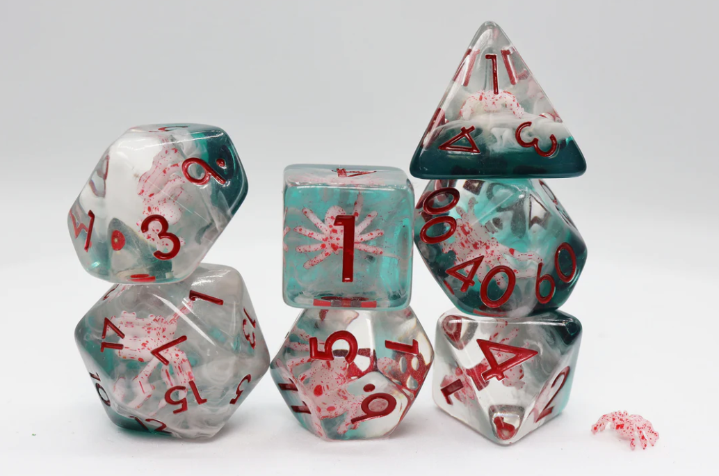 Baby Spider RPG Dice Set with translucent resin polyhedral dice, red numbers, and green-red splatter.