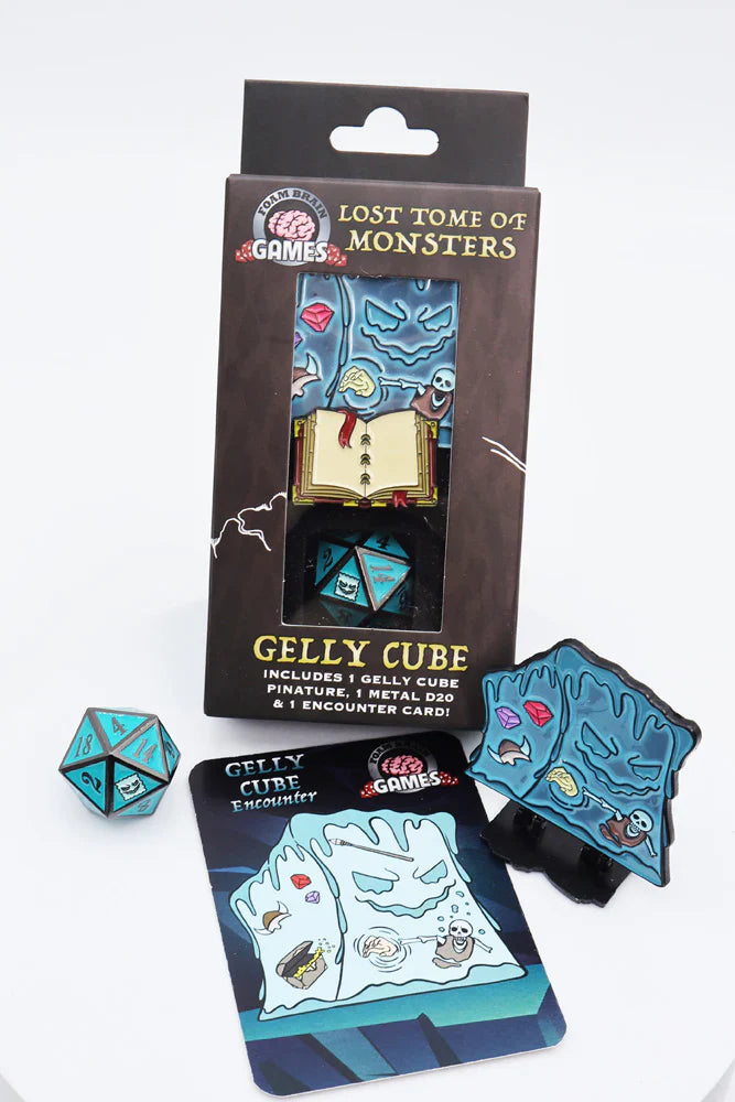 The Lost Tome of Monsters Gelly Cube set with blue metal D20 die, miniature pin, and encounter card.