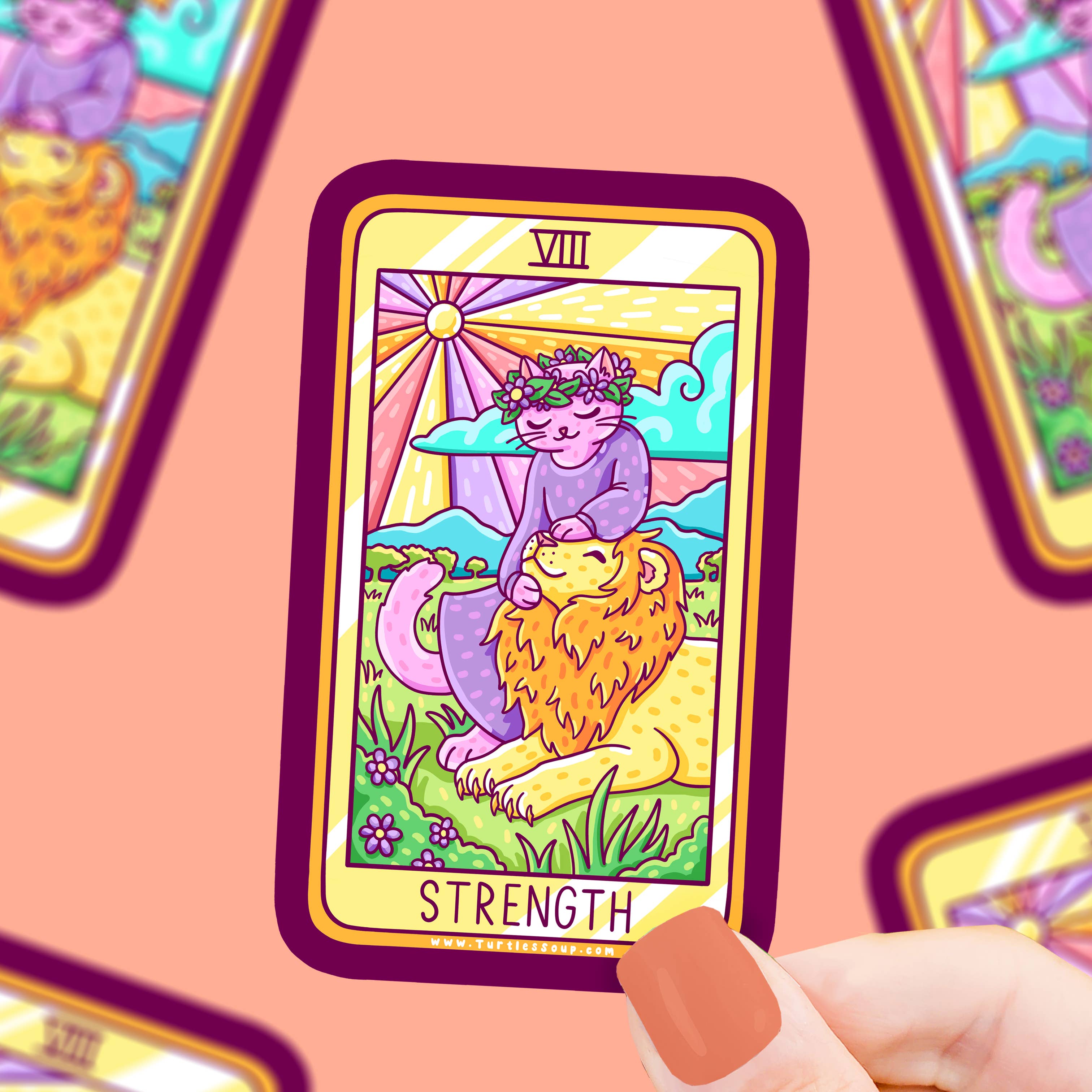 Strength Cat Tarot Card Vinyl Sticker—Major Arcana with lion and floral crown design held in a hand.