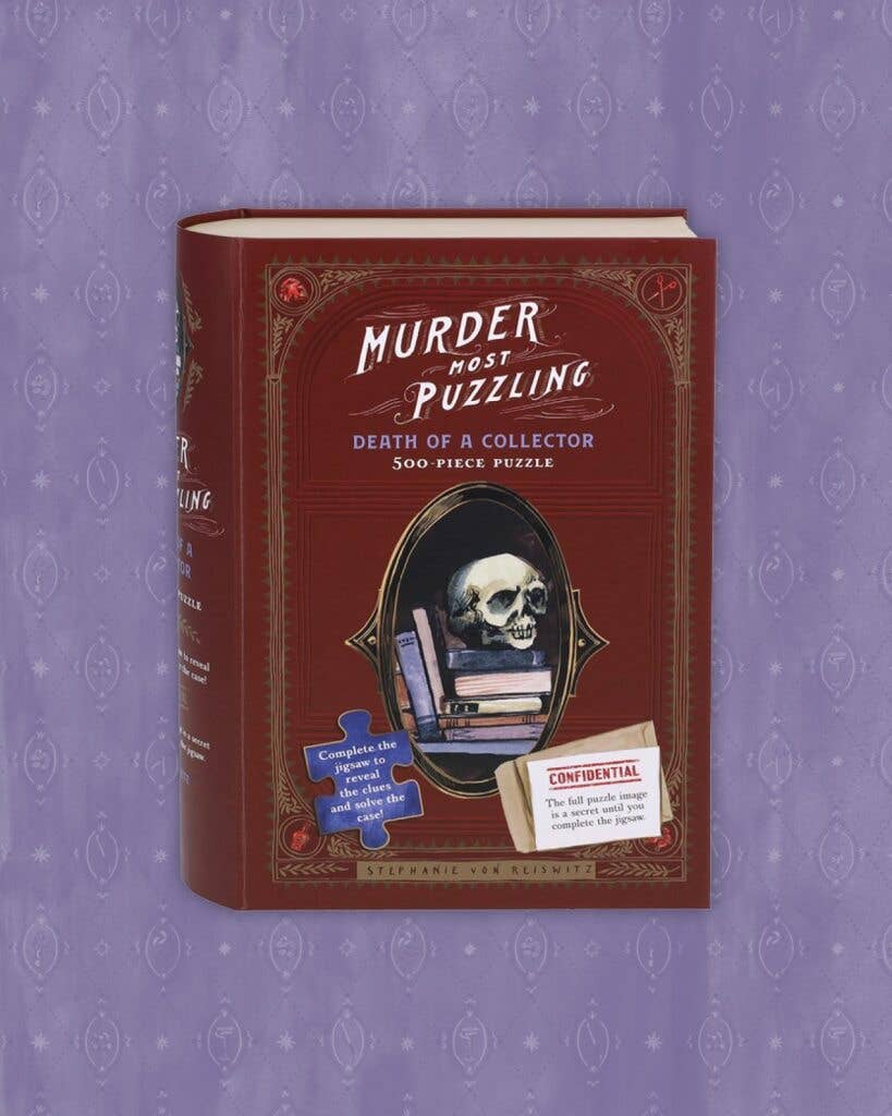 Murder Most Puzzling Death of a Collector 500-piece puzzle with skull, books, and purple background.