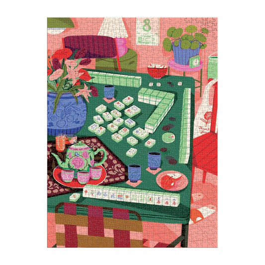 Mahjong Social 1000 Piece Puzzle featuring a Mahjong game on a green table with flowers and cozy decor.