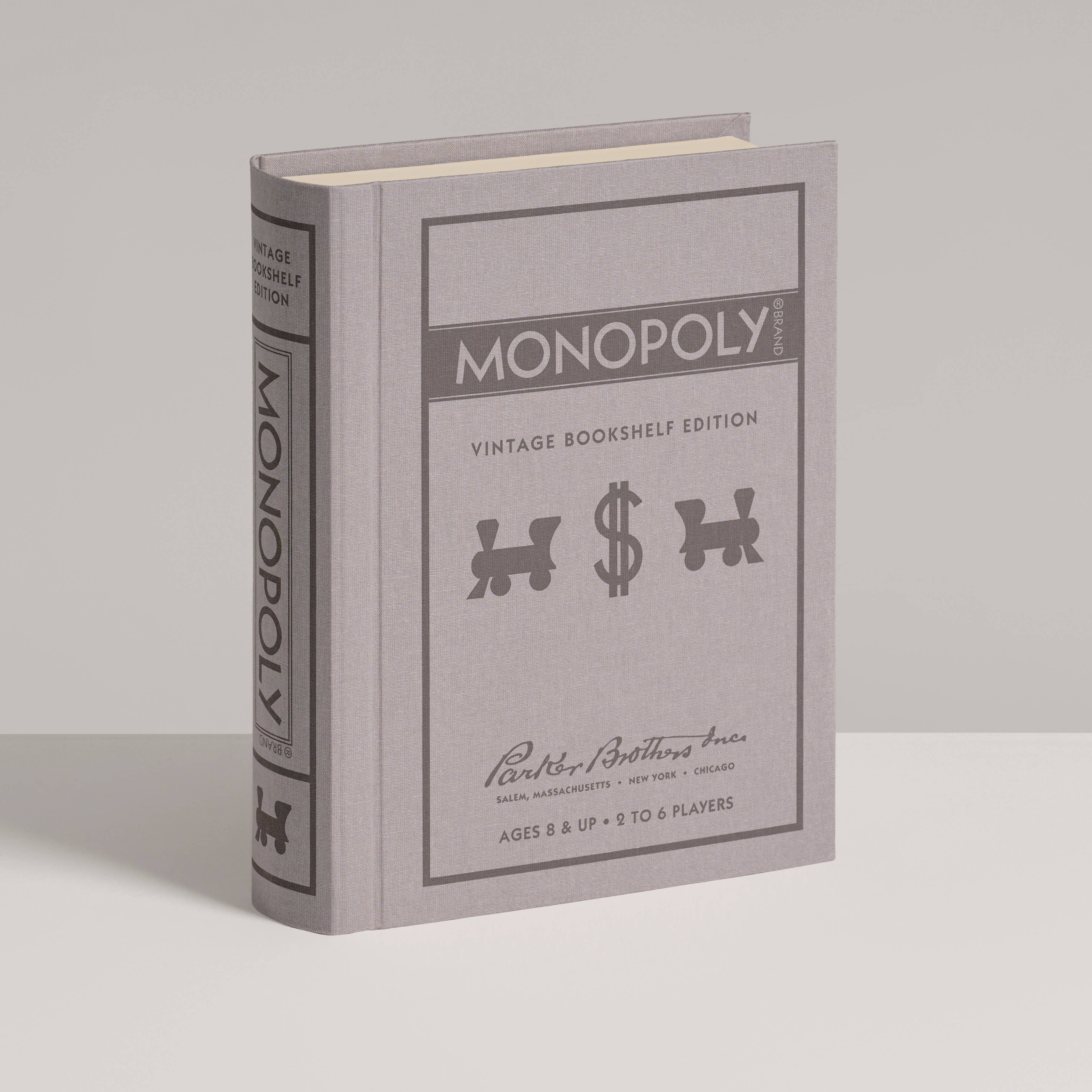 Monopoly Vintage Bookshelf Edition in a grey book-style box with included game components.