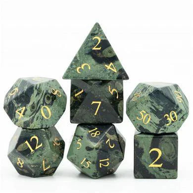 Dark Jasper green-black gemstone dice set with gold engraving, arranged in two columns.