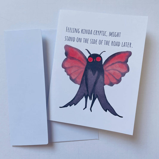 Greeting card with cartoon Mothman and the text Feeling kinda cryptic.