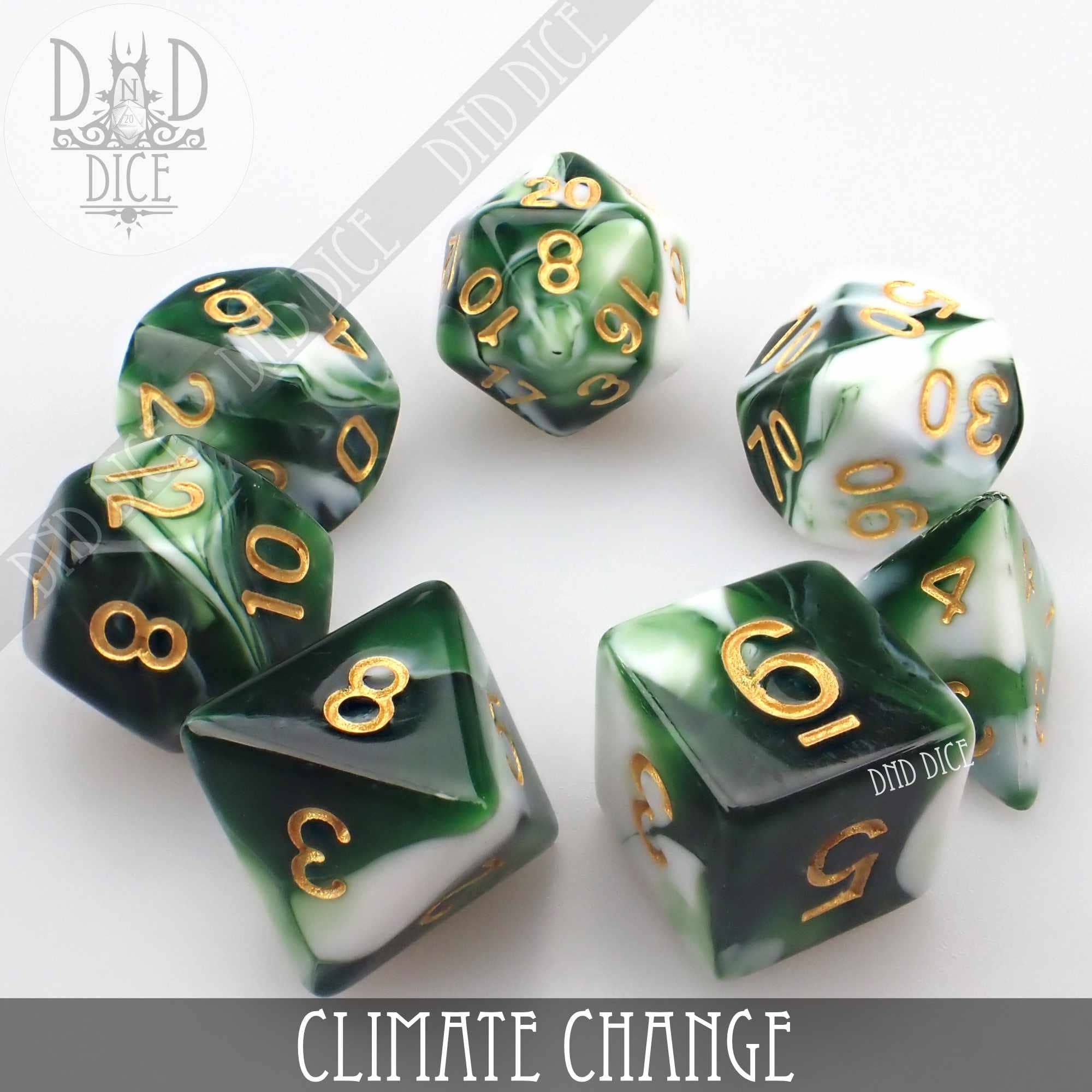 Green and white marbled acrylic dice with gold numbers arranged in a circle. Text: Climate Change 7 or 11.