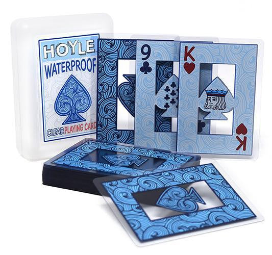 Hoyle Clear Waterproof Cards, 9 of clubs and king of hearts face up, others stacked, case in background.