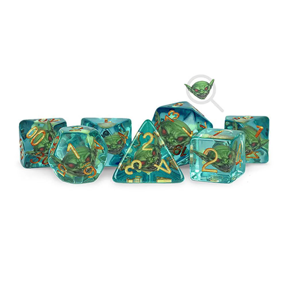 7-piece Pathfinder Goblin Inclusion Dice, blue-green with gold numbers and small goblin figures inside each die.