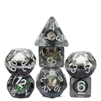 Compass RPG Dice Set with black and clear polyhedral dice, each containing a mini working compass, stacked in two rows.