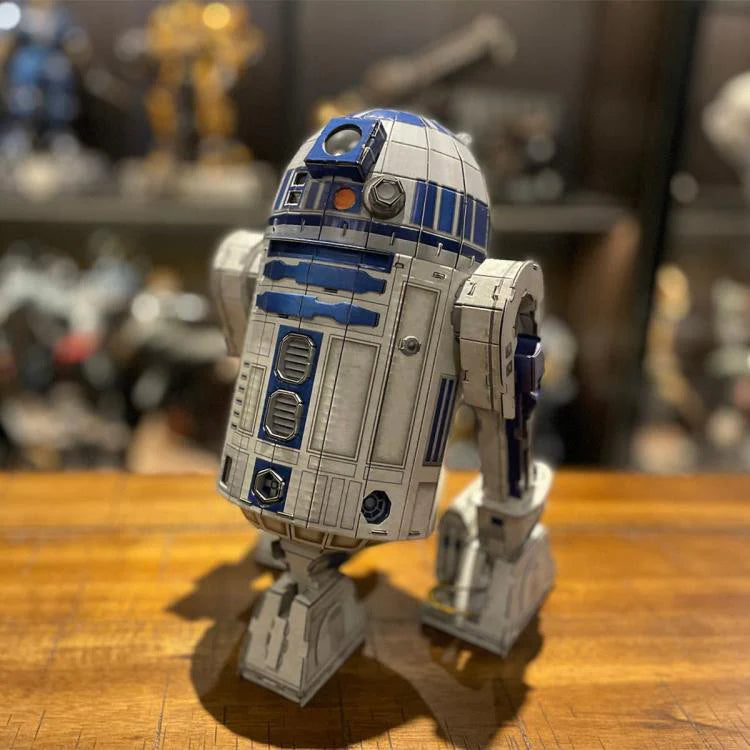 4D Star Wars Model R2-D2 standing on a wooden table.