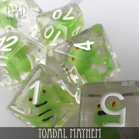 Toadal Mayhem 7-piece dice set: clear resin with green frog inclusions and white numbers.