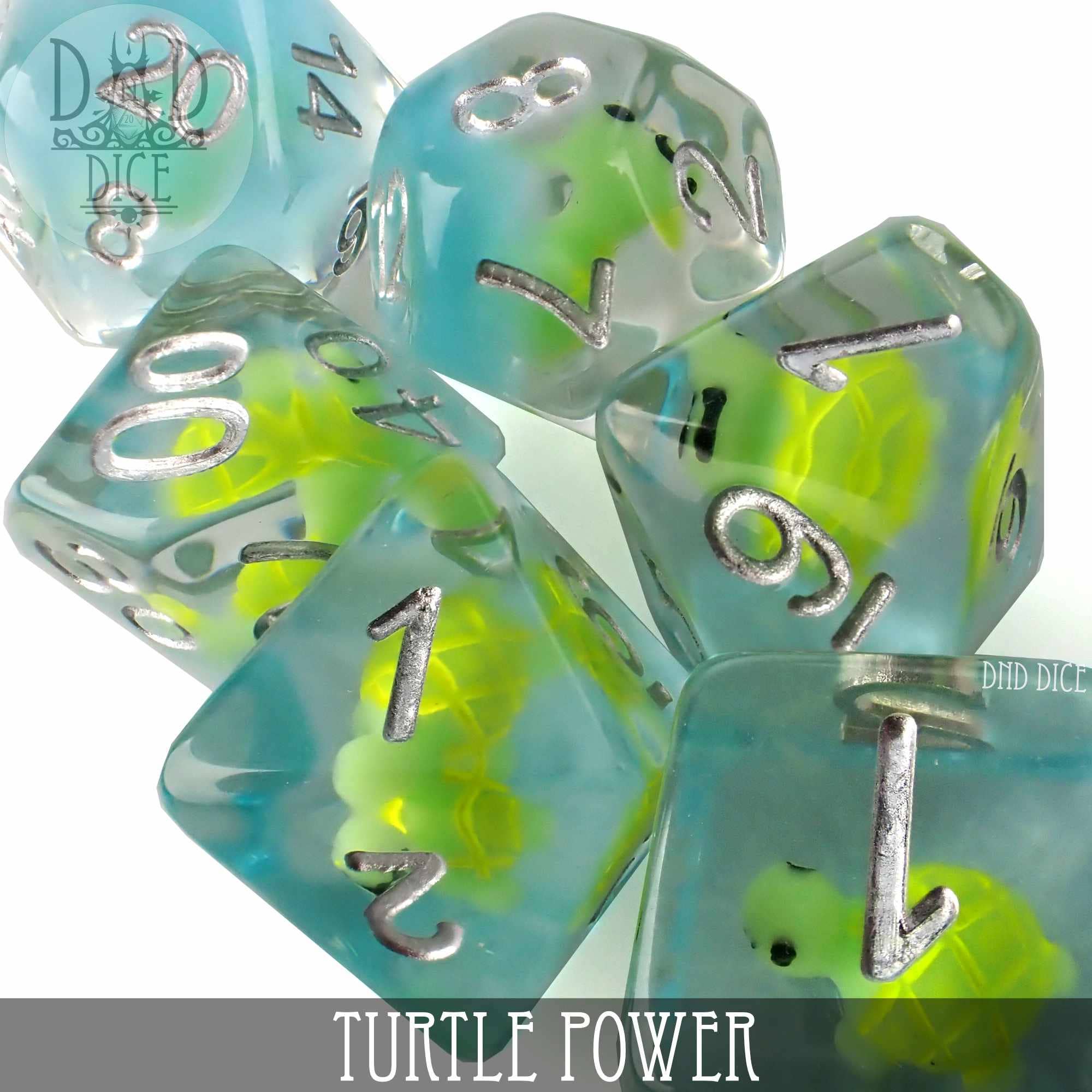 Turtle Power 7-dice set with blue and clear resin, each die containing a small green turtle figure inside.