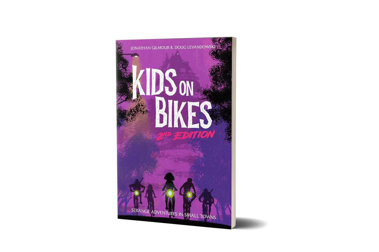 Kids On Bikes 2e book cover featuring silhouettes of kids on bikes.